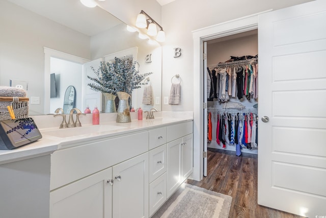 bathroom with vanity and hardwood / wood-style floors