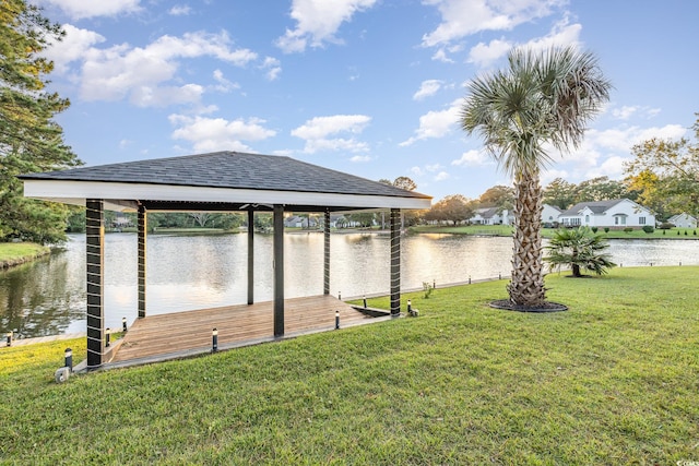 view of dock featuring a lawn, a gazebo, and a water view