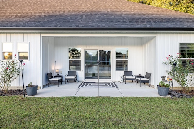 back of property featuring a patio and a yard