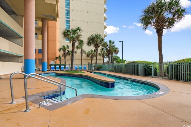 view of swimming pool with a patio area