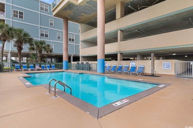 view of pool featuring a patio area