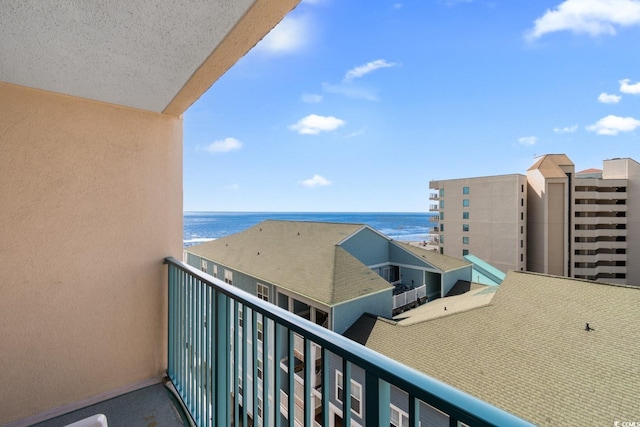 balcony featuring a water view