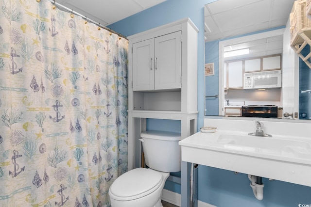 bathroom with walk in shower and toilet