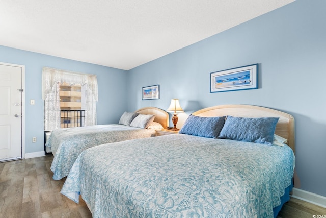 bedroom featuring wood-type flooring