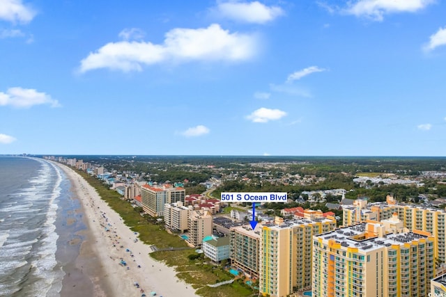 aerial view with a view of the beach and a water view