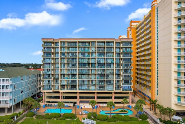 view of property featuring a community pool