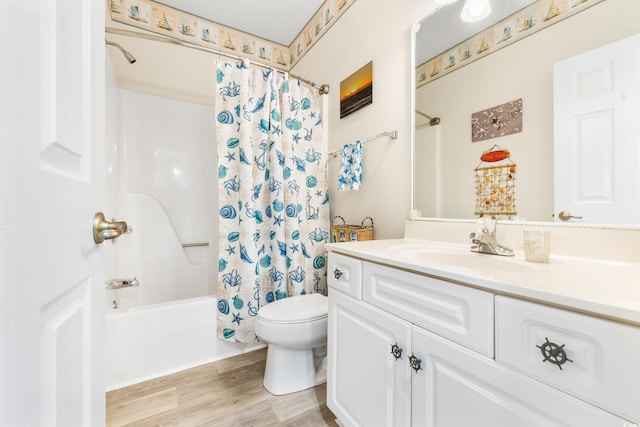 full bathroom featuring hardwood / wood-style floors, vanity, toilet, and shower / bath combination with curtain