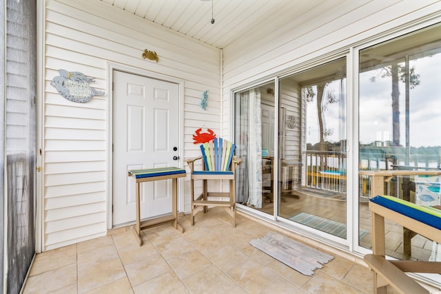 sunroom featuring wooden ceiling