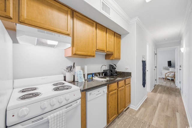 kitchen featuring visible vents, a sink, dark stone countertops, white appliances, and under cabinet range hood