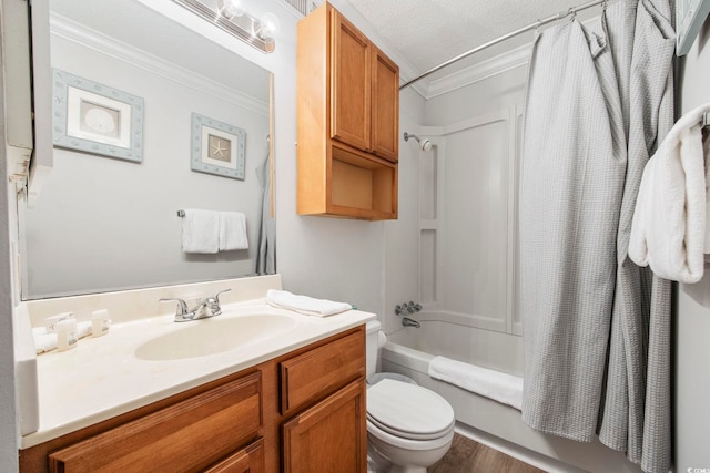 bathroom with crown molding, toilet, shower / bath combo with shower curtain, a textured ceiling, and vanity