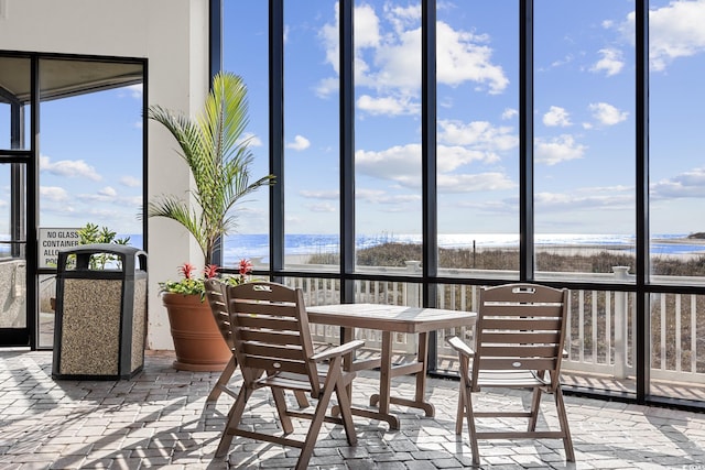 sunroom with a water view