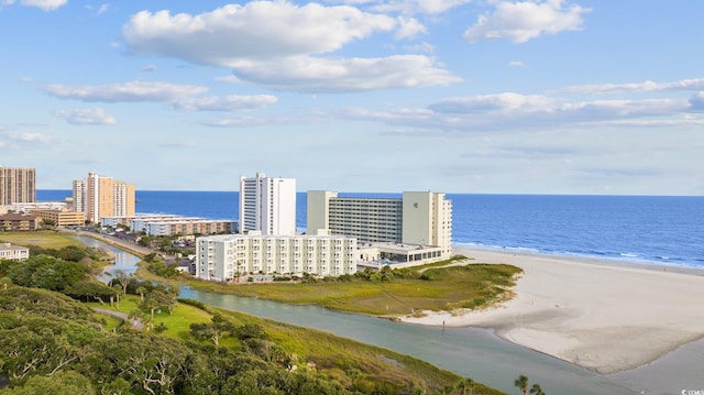 birds eye view of property featuring a water view, a view of city, and a view of the beach