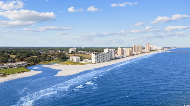 drone / aerial view with a water view, a view of city, and a view of the beach