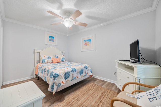 bedroom featuring dark wood-type flooring, crown molding, a textured ceiling, and baseboards