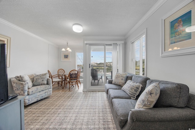 living room with a textured ceiling, light wood-type flooring, and crown molding