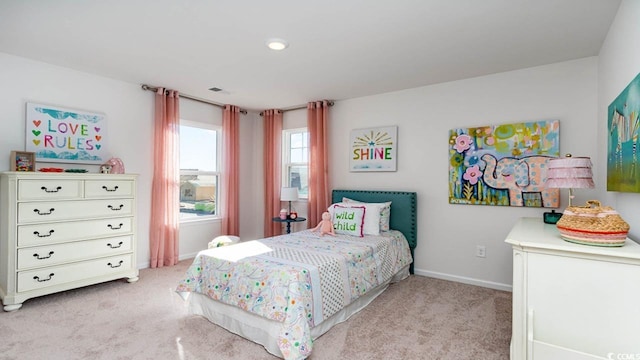 bedroom with light colored carpet