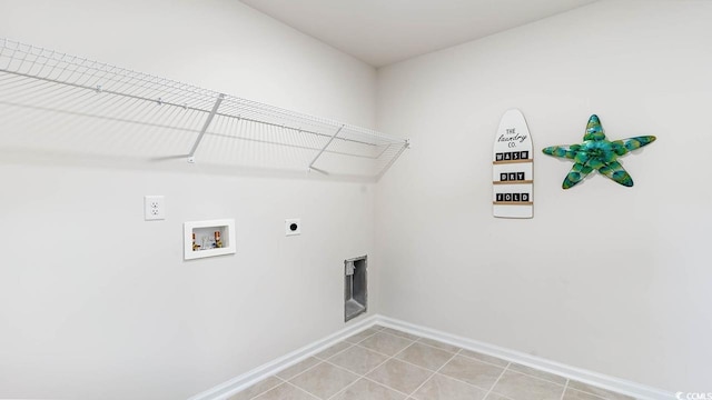 laundry area featuring hookup for an electric dryer, washer hookup, and light tile patterned floors