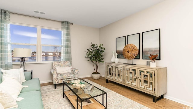 sitting room featuring light hardwood / wood-style flooring