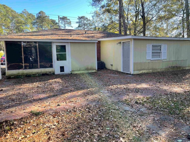 back of property featuring a sunroom