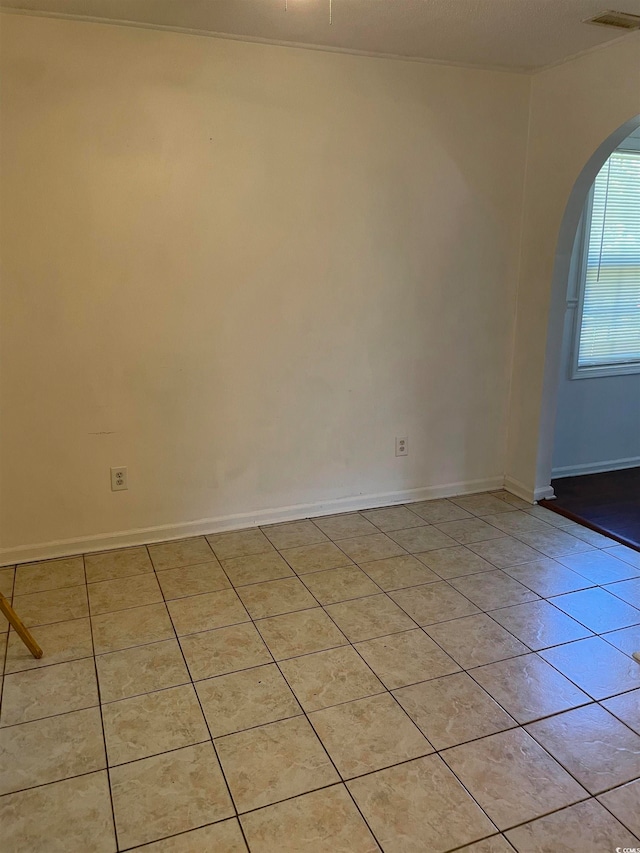 unfurnished room with light tile patterned floors