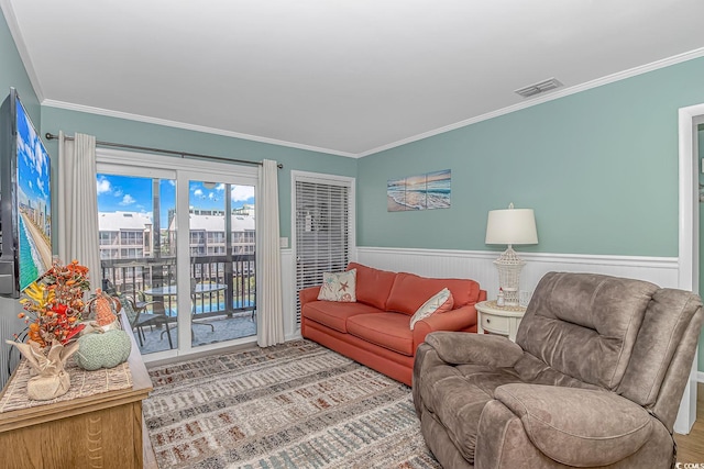 living room with ornamental molding and wood-type flooring