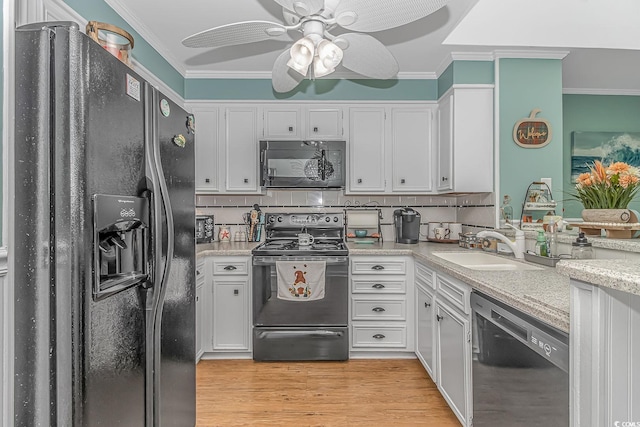 kitchen featuring light hardwood / wood-style flooring, black appliances, crown molding, white cabinets, and ceiling fan