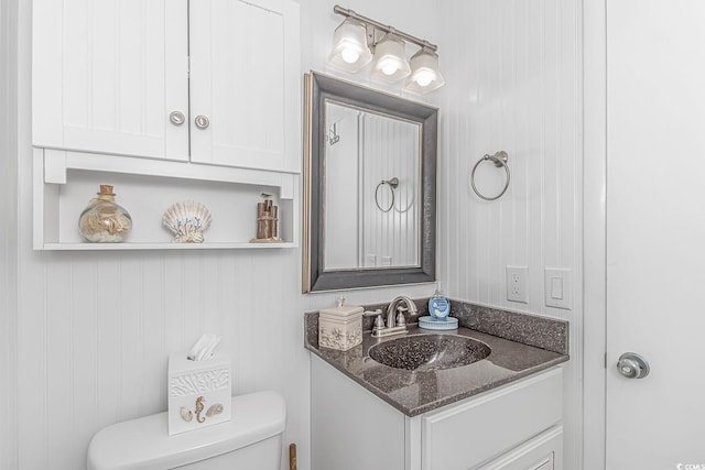 bathroom with vanity and toilet