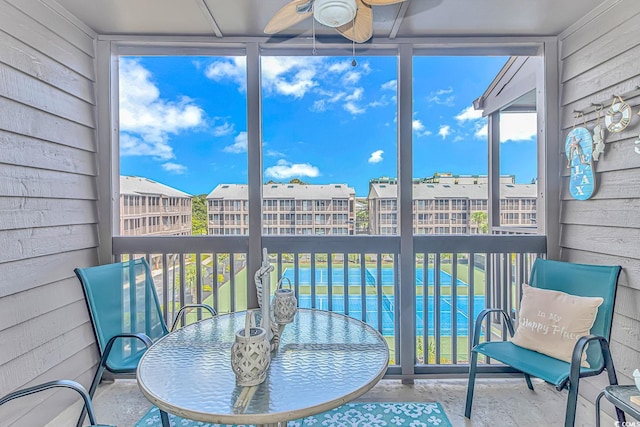 sunroom / solarium with ceiling fan