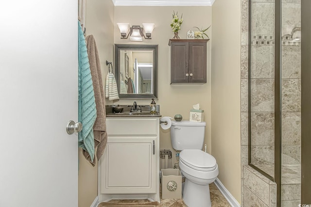 bathroom with vanity, ornamental molding, and toilet