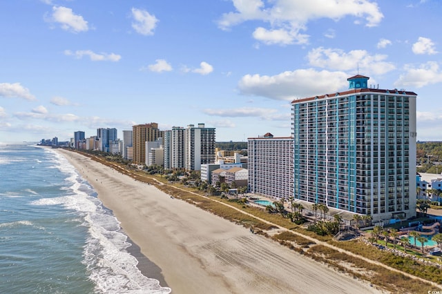 drone / aerial view with a water view and a view of the beach