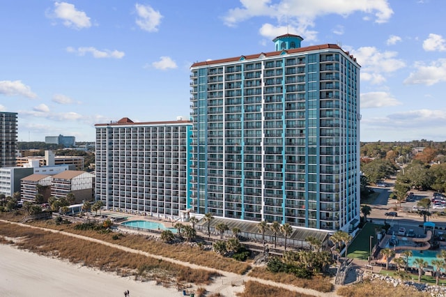 view of property featuring a community pool