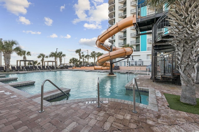 view of swimming pool featuring a water slide