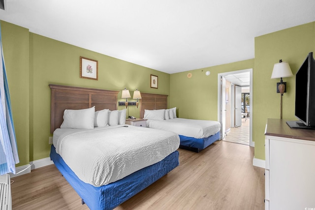 bedroom with light hardwood / wood-style floors