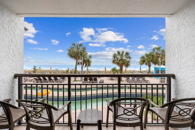 balcony featuring a water view