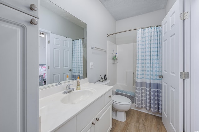 9772 Leyland Dr Unit 9772-9, Myrtle Beach, SC 29572 - full bathroom featuring vanity, wood finished floors, toilet, shower / bath combo, and a textured ceiling