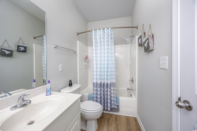 9772 Leyland Dr Unit 9772-9, Myrtle Beach, SC 29572 - bathroom with vanity, wood finished floors, shower / tub combo with curtain, toilet, and a textured ceiling