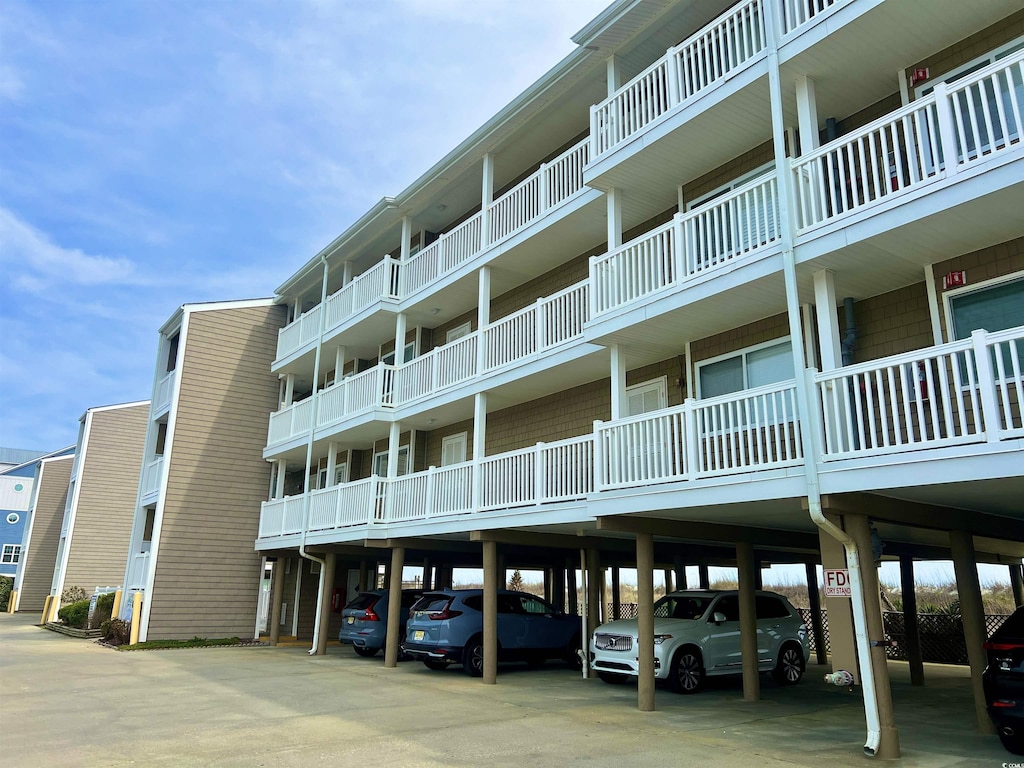 4800 N Ocean Blvd Unit 2-B, North Myrtle Beach, SC 29582 - view of property with covered parking