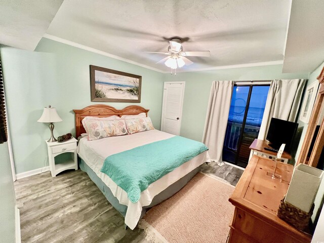 bedroom with baseboards, ornamental molding, wood finished floors, ceiling fan, and access to outside