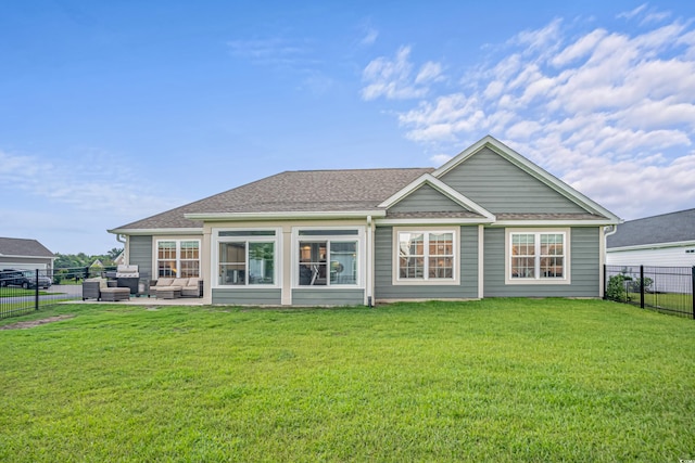 rear view of property with an outdoor hangout area, a yard, and a patio