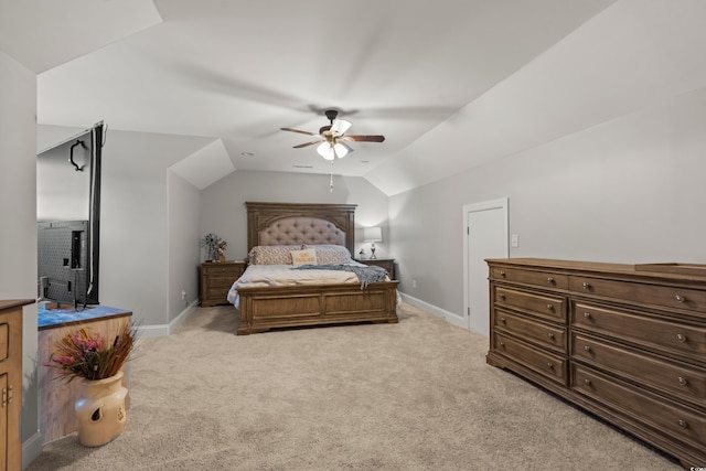 carpeted bedroom with ceiling fan and lofted ceiling