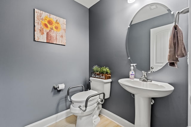 bathroom featuring tile patterned flooring and toilet