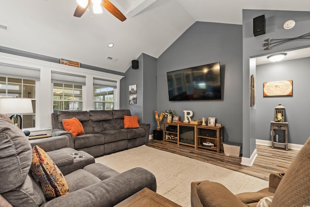 living room featuring high vaulted ceiling, hardwood / wood-style floors, and ceiling fan