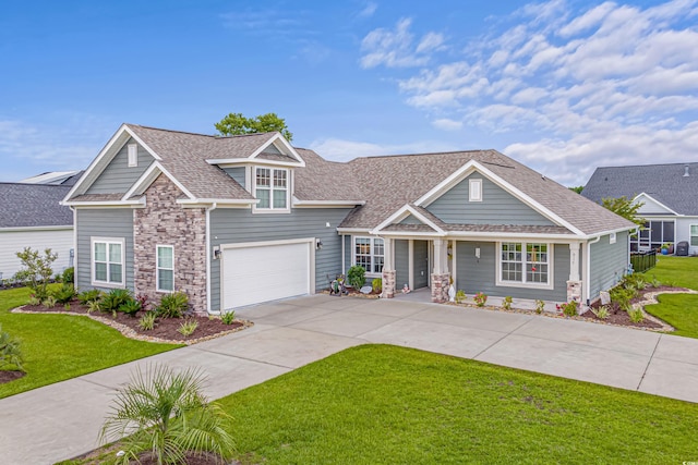 craftsman-style home with a garage and a front lawn