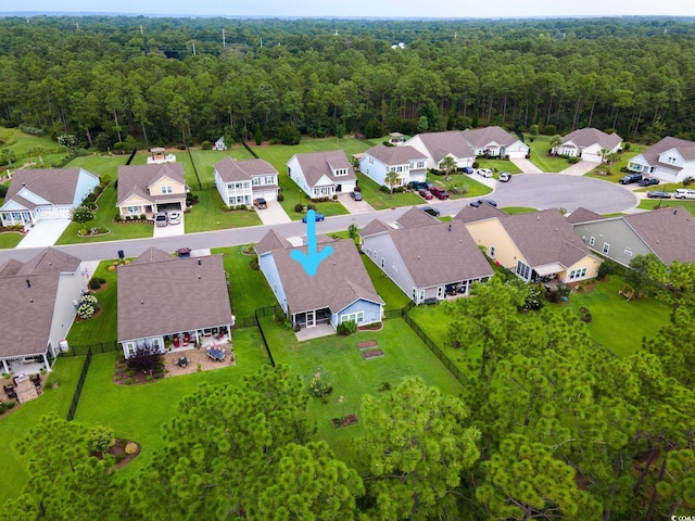 bird's eye view with a residential view and a view of trees