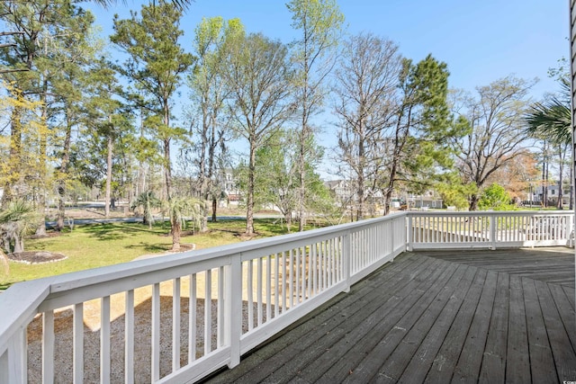 wooden terrace with a yard