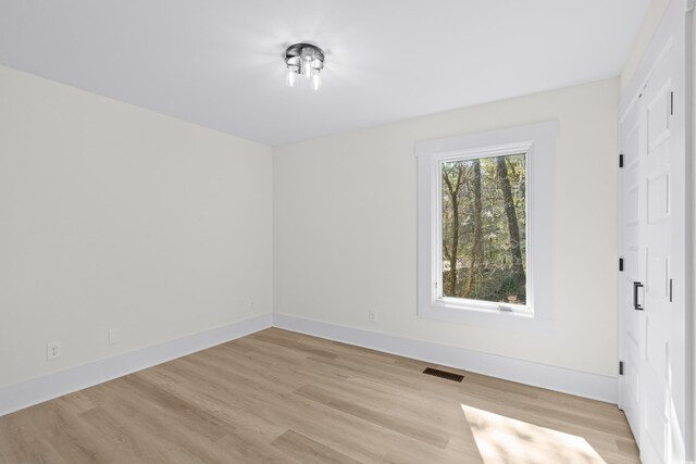 unfurnished room featuring light wood-type flooring