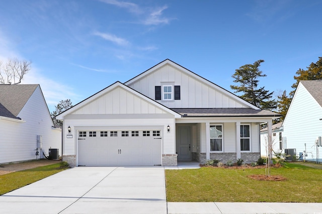 view of front of home with a garage, a porch, central AC unit, and a front lawn