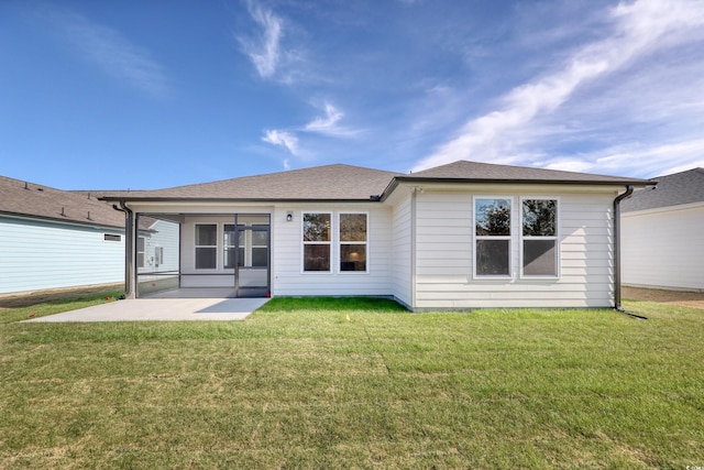 back of property featuring a yard and a patio area