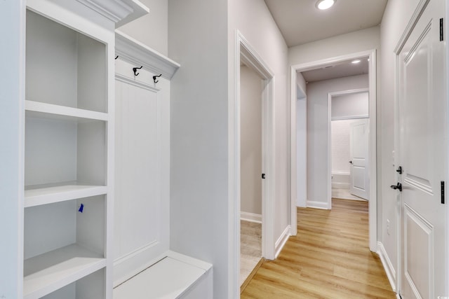 mudroom with light hardwood / wood-style flooring