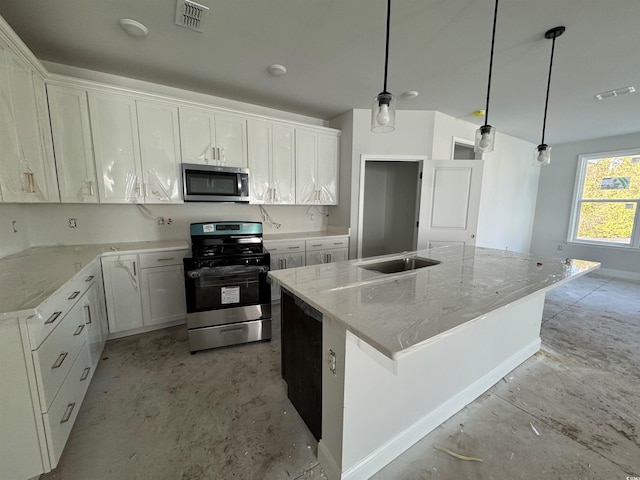 kitchen featuring appliances with stainless steel finishes, pendant lighting, a center island with sink, and white cabinets